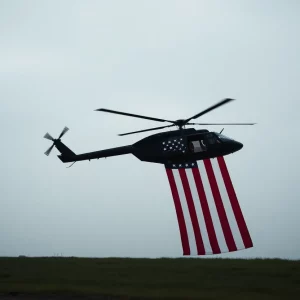 A helicopter flying over a field with an American flag in the foreground